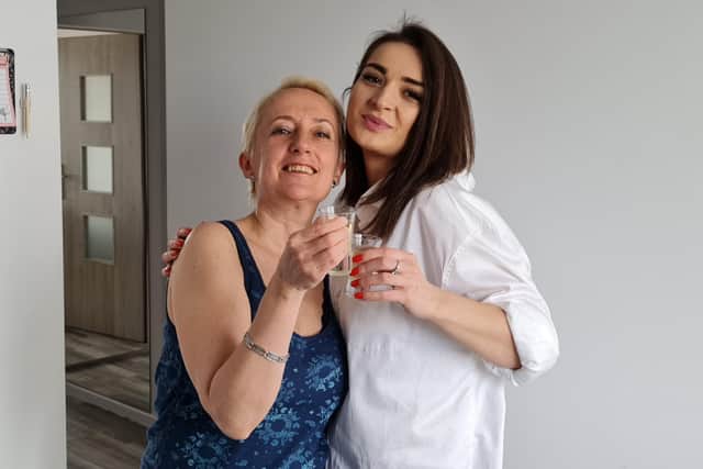 Monika Rozwarzewska with her friend Iryna - who is currently staying in her flat in Poland SUS-220303-152154001
