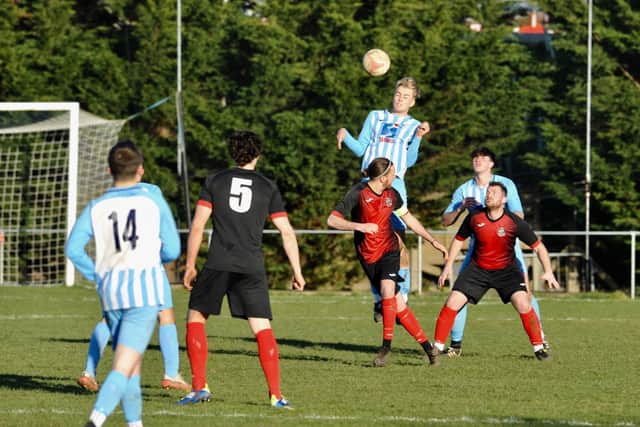 Worthing Utd clear the danger at Wick / Picture: Stephen Goodger