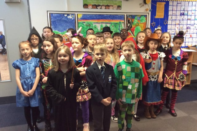 Pupils from Abbey CoE show off their colourful costumes.