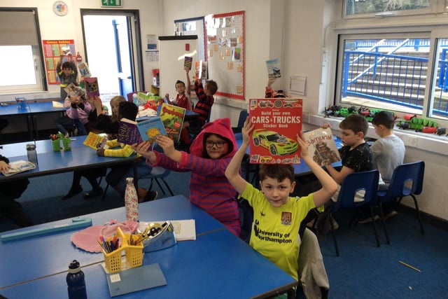 Showing off their favourite books.