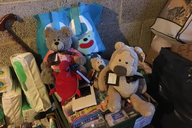 Some of the donated items and teddies SUS-220403-163937001
