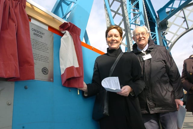 Council chief executive Gillian Beasley unveils the Civic Society's plaque on Crescent Bridge with the Rev Richard Paten.