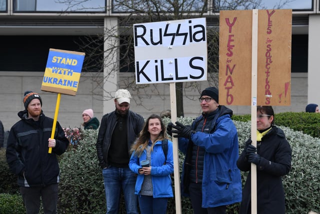 Protesters with anti war placards joined the rally organised by Milton Keynes Peace and Justice Network