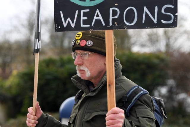 Protesters with anti war placards joined the rally organised by Milton Keynes Peace and Justice Network