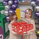Annabelle Tierney and her sister Florence at Morrisons in Worthing with some of the Easter eggs