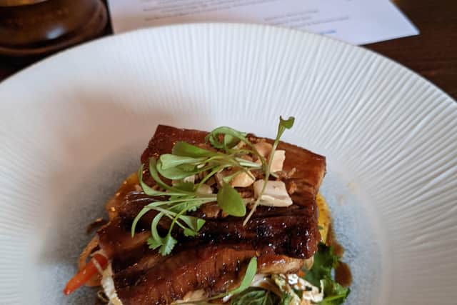 Ben Miller's signature dish at the White Horse Inn - crispy Asian belly of pork in black spiced vinegar caramel, green papaya and orange salad and roasted shallots and peanuts.