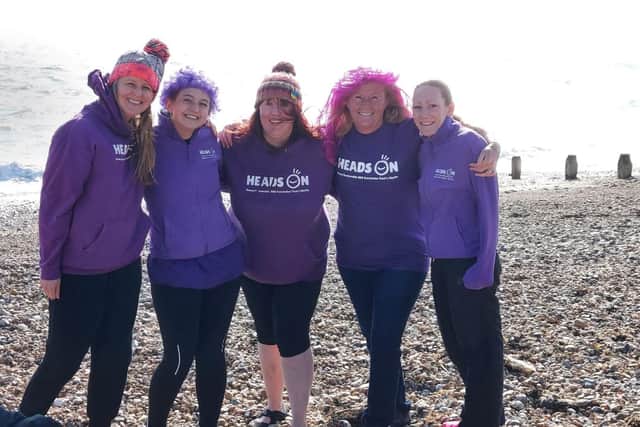 A team from the NHS mental health charity Heads On has taken on a dip in the sea in Worthing for 1.6 minutes to mark International Women’s Day.
The event aims to raise awareness of the estimated 1.6 million women aged 16-74 that experience domestic abuse in the UK each year