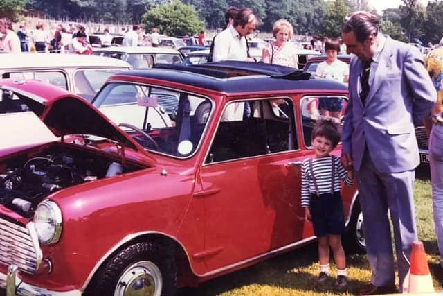 Mini Cooper founder John Cooper pictured with his grandson Charlie in the mid-1980s