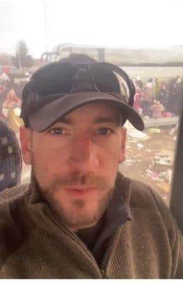 Veteran British Army sniper Shane Matthew, pictured, pictured as he passes thousands of refugees in scenes he described as 'heartbreaking'