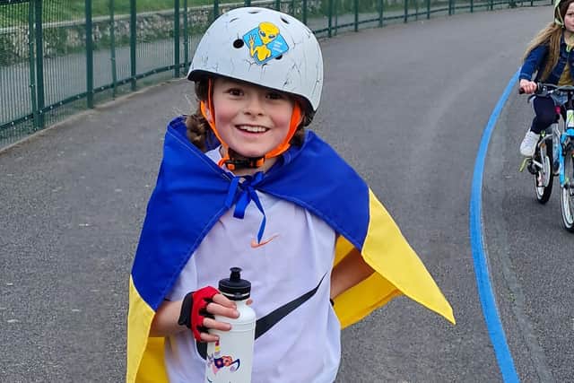 Amelie Brown, nine, decided she wanted to do a sponsored bike ride to help children in Ukraine