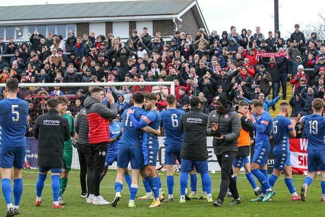 Worthing players and their fans celebrate the win at Lewes / Picture: James Boyes