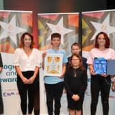 Super Siblings accepting the Charity of the Year award from Community Awards Judge Katie Bennett in 2021
