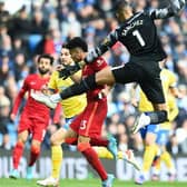 Brighton and Hove Albion goalkeeper Robert Sanchez clatters into Liverpool attacker Luis Diaz at the Amex Stadium