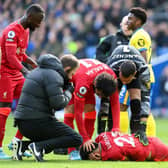 Luis Diaz was hurt after colliding with Brighton goalkeeper Robert Sanchez, whilst heading Liverpool into a first-half lead (Photo by Mike Hewitt/Getty Images)