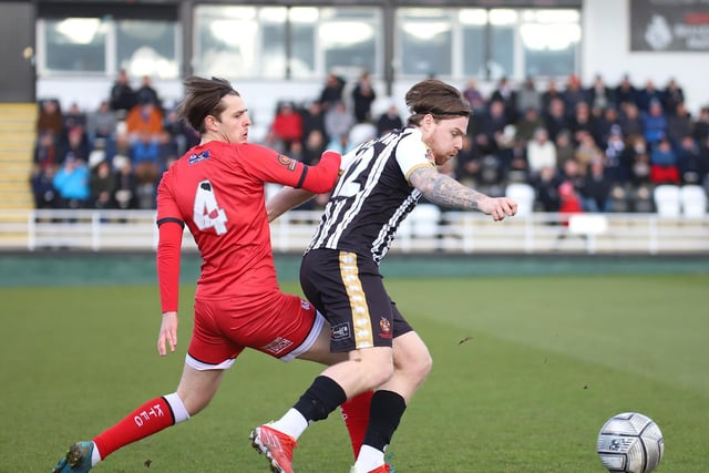Kettering loanee Jack Smith challenges a Spennymoor opponent