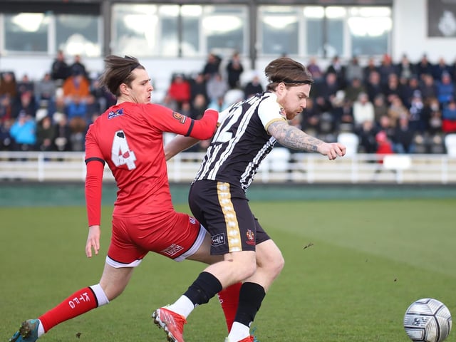 Kettering loanee Jack Smith challenges a Spennymoor opponent