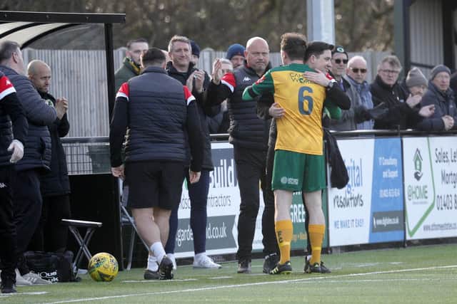Manager Dominic Di Paola embraces Gary Charman as he departs the pitch for the last time