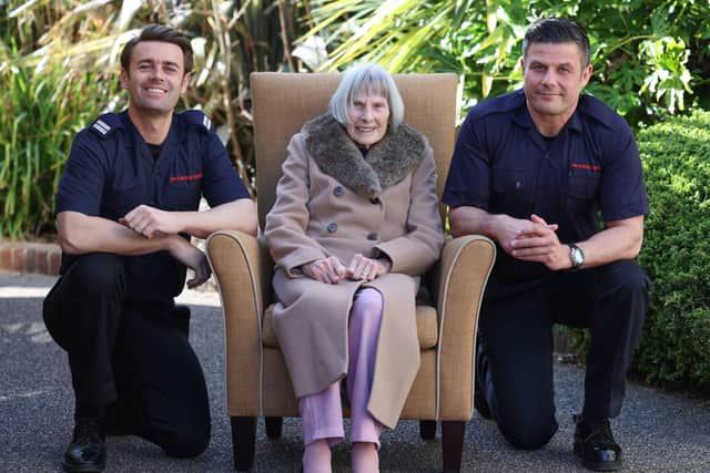Worthing Fire Station crew manager Michael Coudray, left, and and firefighter Alf Ancell with Gladys Jones