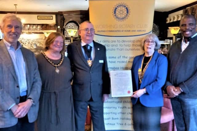 Worthing Rotary president Sally Nowak at the Grand Victorian Hotel with the original Rotary charter, accompanied by Worthing mayor and mayoress Lionel and Karen Harman, Peter Kemp-Potter, great nephew of the founding president, left, and vice-president Steve Grant