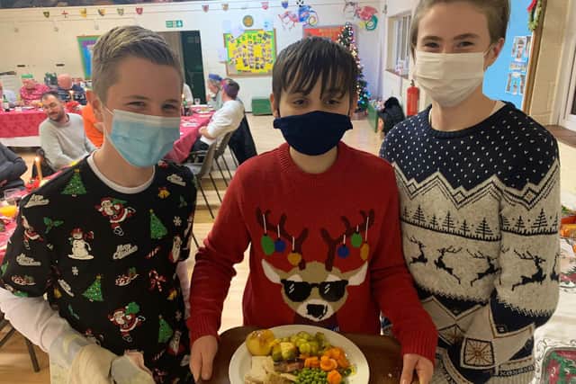 The boys serving Christmas dinner