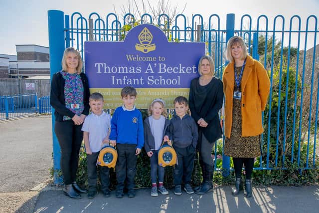 Headteacher Amanda Dingwall, deputy head Collette Wade, teaching assistant Nicky Wall and pupils with the AED devices at Thomas A'Becket Infant School in Tarring