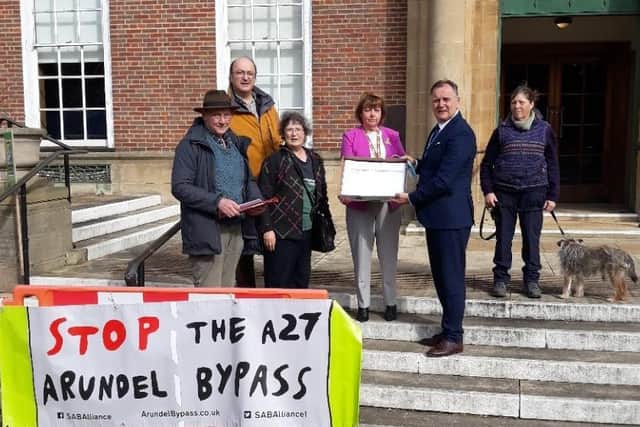Campaigners met against outside County Hall in Chichester to hand over a petition, with 6,307 signatures, to council leader Paul Marshall and deputy leader Deborah Urquhart. Photo: Louise Higham
