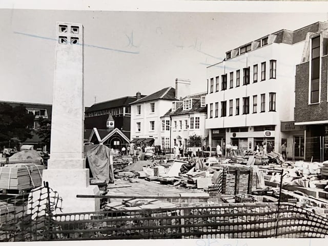 The  war memorial being moved in Horsham's Carfax in 1991
