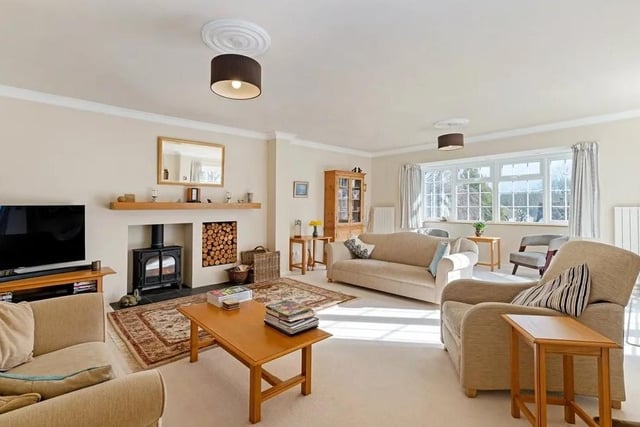 Thedual aspect sitting room features a bay window and French doors to the front patio. Picture: Savills - Haywards Heath.