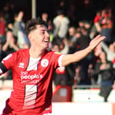 Isaac Hutchinson celebrates his goal for Crawley Town against Swindon Town. Picture by Cory Pickford