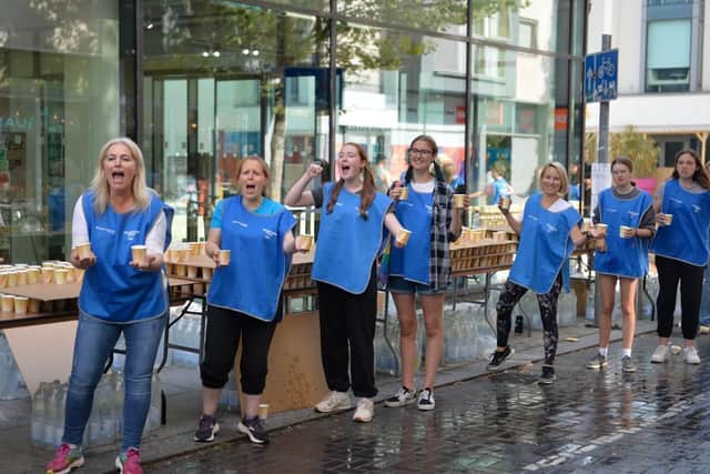Some of the volunteers giving out water at last year's marathon