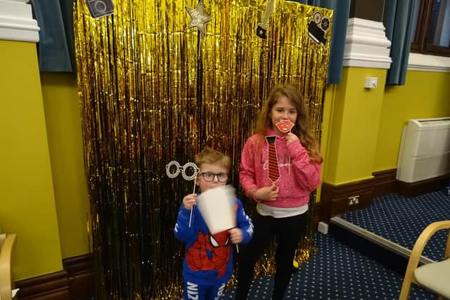 The young carers were treated to food and drink as they watched themselves on the big screen in the event arranged by Care for the Carers and Culture Shift. SUS-220321-110746001