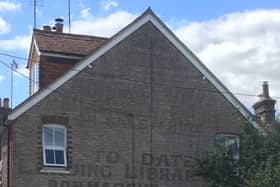 Mystery surrounds the 'ghost sign' on the side of a building in Slinfold