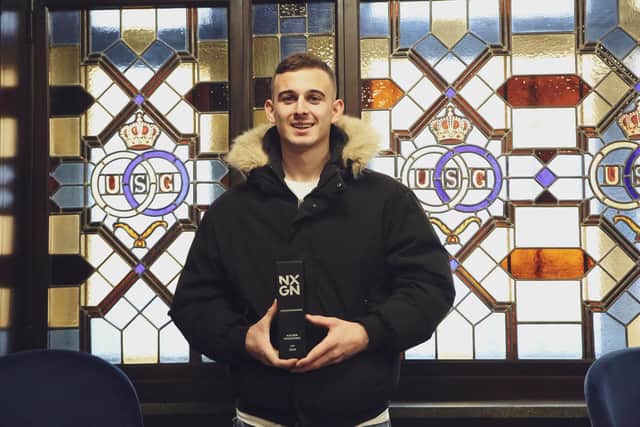Brighton top talent Kacper Kozlowski receives his award from NXGN