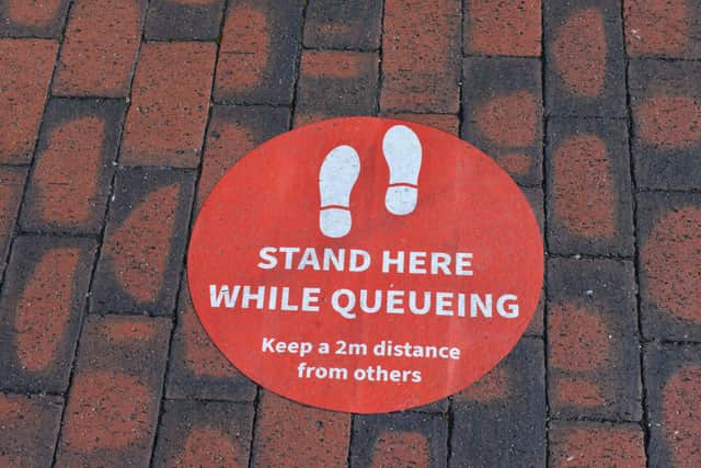 Social distancing sign in Eastbourne town centre SUS-220322-111027001