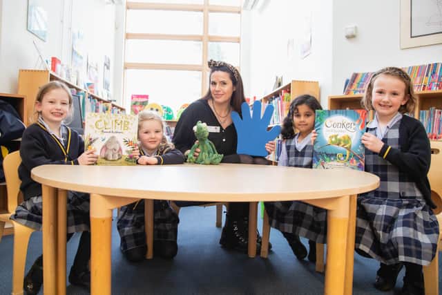 Author thanks supportive celebrity pal Holly Willoughby as she returns to their old school for book week