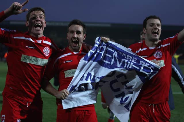 Sam Rents (left) celebrates with Matt Tubbs (centre) and Craig McAllister after Crawley Town's FA Cup win over Torquay United in 2011. Picture by Michael Steele/Getty Images