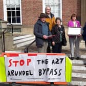 Members of local groups opposed to an Arundel Bypass grey route hand over a petition with more than 6,000 signatures to Paul Marshall and Deborah Urquhart
