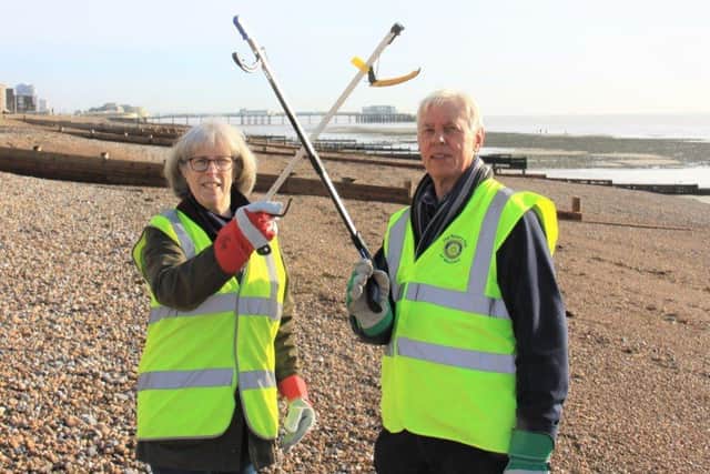 Worthing Rotary president Sally Nowak and Haydn Smith try out litter picking equipment ahead of the beach clean