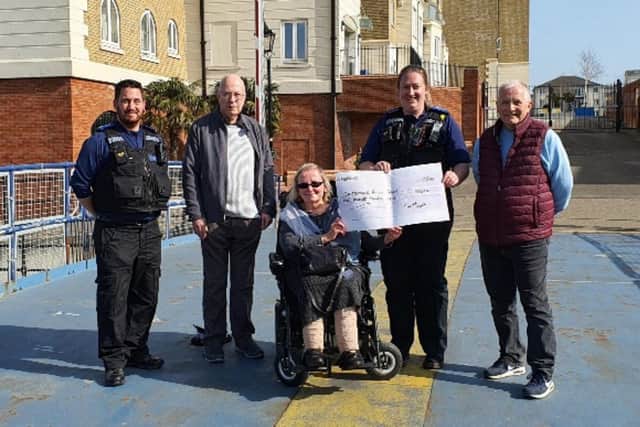 PCSO Karrie Agnew and PCSO Nick Cox presenting the £500 donation to the Eastbourne Access Group SUS-220323-133700001