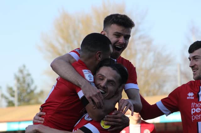 Crawley celebrate Tom Nichols' goal against Swindon last week. Credit Cory Pickford