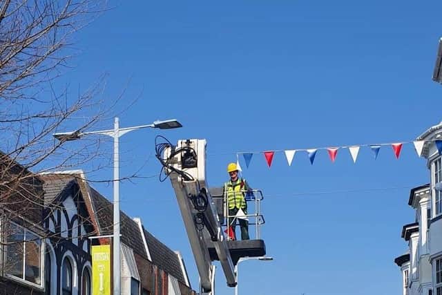 The Bognor Regis Town Force putting up celebratory bunting