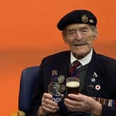 Major Ted Hunt celebrating his 102nd birthday with a pint at Care for Veterans in Worthing
