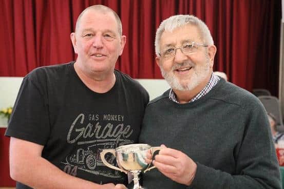 Chairman Charles Ashby (right) presenting the cup to Tony Hills