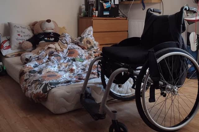 Georgia's wheelchair next to the mattress on the floor she has had to sleep on for months. SUS-220325-104504001