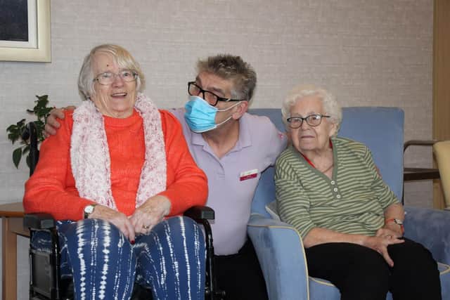 Dan Peacock with residents Iris Barden and Joan Short SUS-220329-102502001