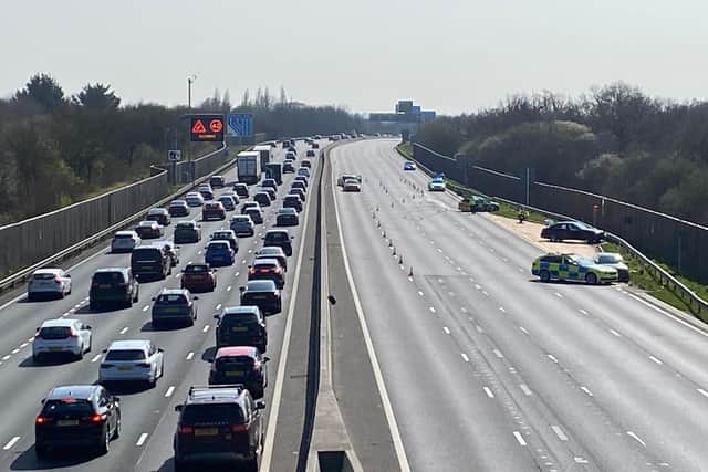 Police officers are investigating and three lanes on the M23 remain closed. Photo: Tasha Cane