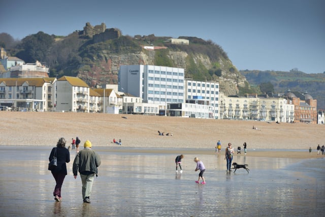 People enjoying the warm March weather on Hastings beach. Photo taken on March 26. SUS-220326-133317001