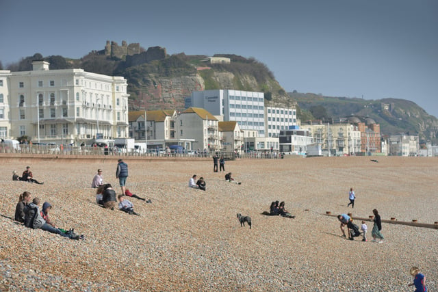 People enjoying the warm March weather on Hastings beach. Photo taken on March 26. SUS-220326-133330001