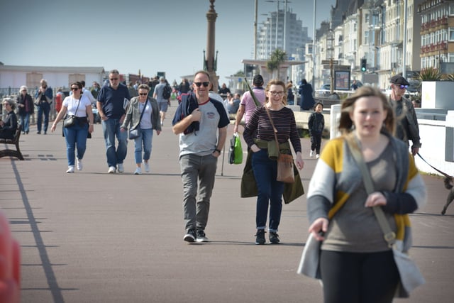 People enjoying the warm March weather on Hastings prom. Photo taken on March 26. SUS-220326-132856001