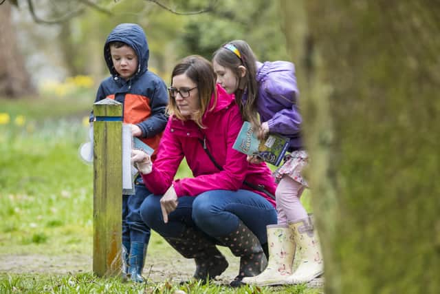 Visitors on an Easter egg hunt at Winkworth Arboretum, Surrey. National Trust image